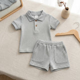 Conjunto polo acanalado de algodón para bebé (polera + short) color gris melange